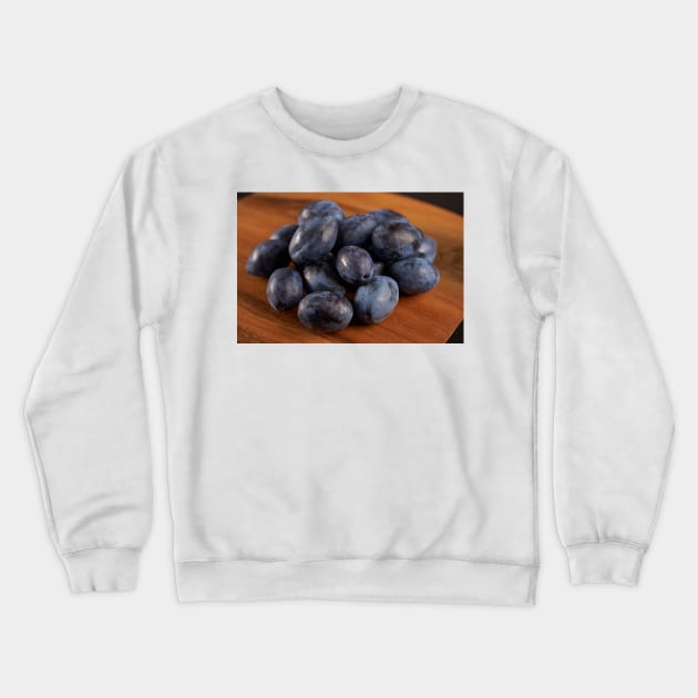 Blue plums in a collander Crewneck Sweatshirt by naturalis